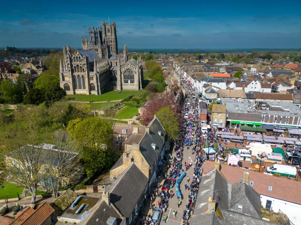Ely EEL Festival makes its way through the city - News for Peterborough Dubbed ‘Coronation Eel Day’ the spectacular eel focal point snaked its way from Cross Green through the streets to Jubilee Gardens to begin a packed day of events by the river. Picture: TERRY HARRIS
