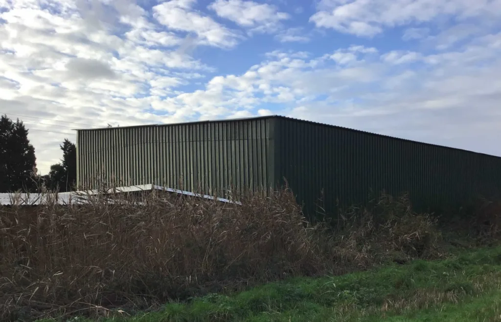Retrospective planning permission for 9 shipping containers and 1 industrial unit has been applied for at The Barracks in Ramsey Road, Farcet Fen, near Peterborough