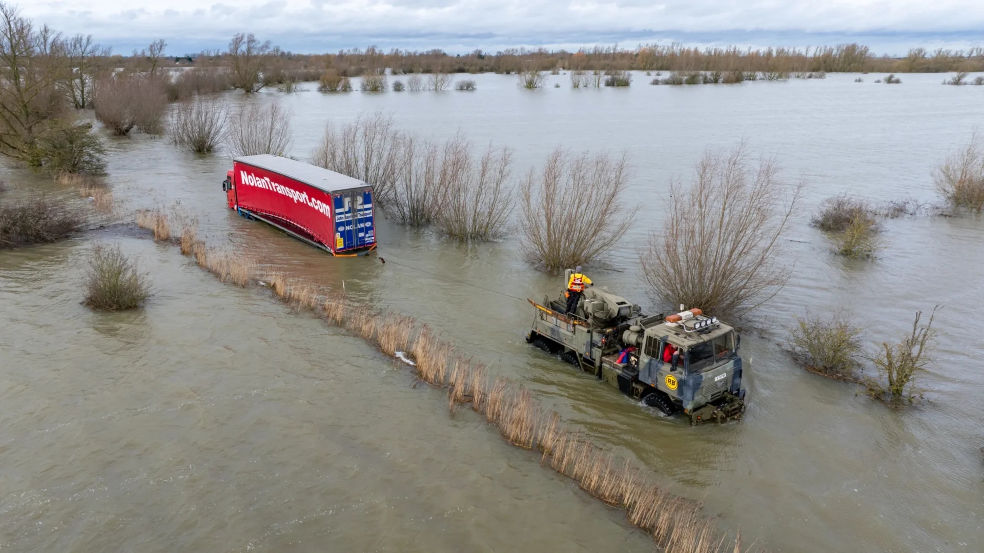 Recovery team from Manchetts were praised for their efforts in retrieving this cab and trailer that the driver was forced to abandon in the early hours of Monday on the flooded A1101 Welney Wash Road. PHOTO: Bav Media