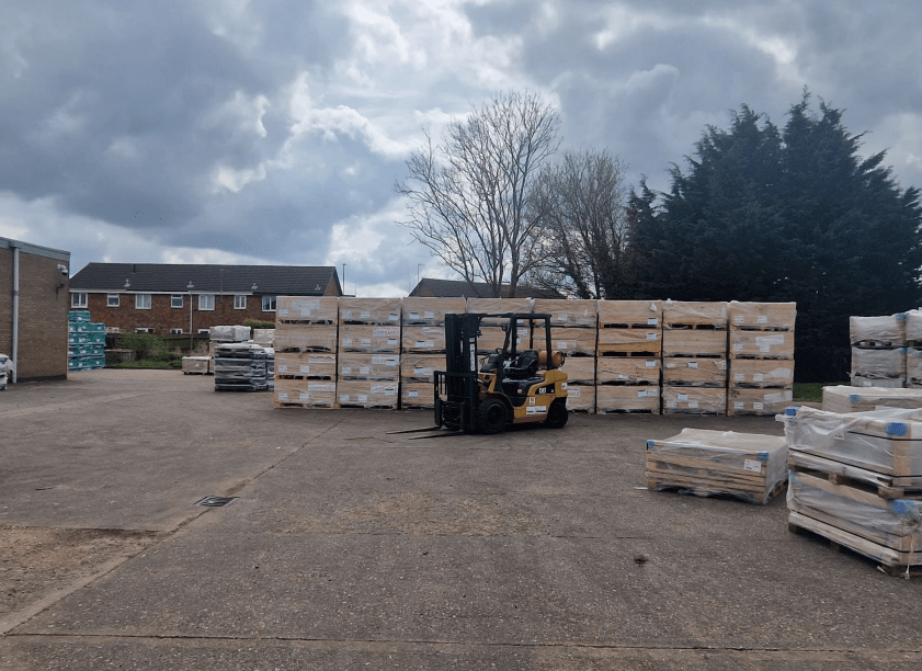 News for Peterborough - Photo of the pallets stacked outside 3-5 Prospect Way, Chatteris, which have been ordered to be removed after businessman loses appeal against Fenland Council decision
