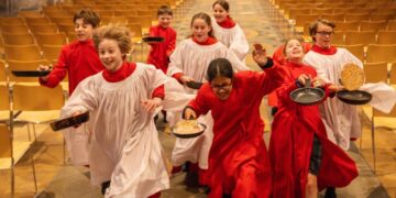 Choristers from Ely Cathedral putting in some practice for this year’s pancake race which was held on Shrove Tuesday (March 4) IMAGE: BavMedia